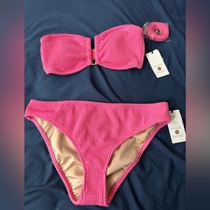 The top is size small and the bottom is medium.